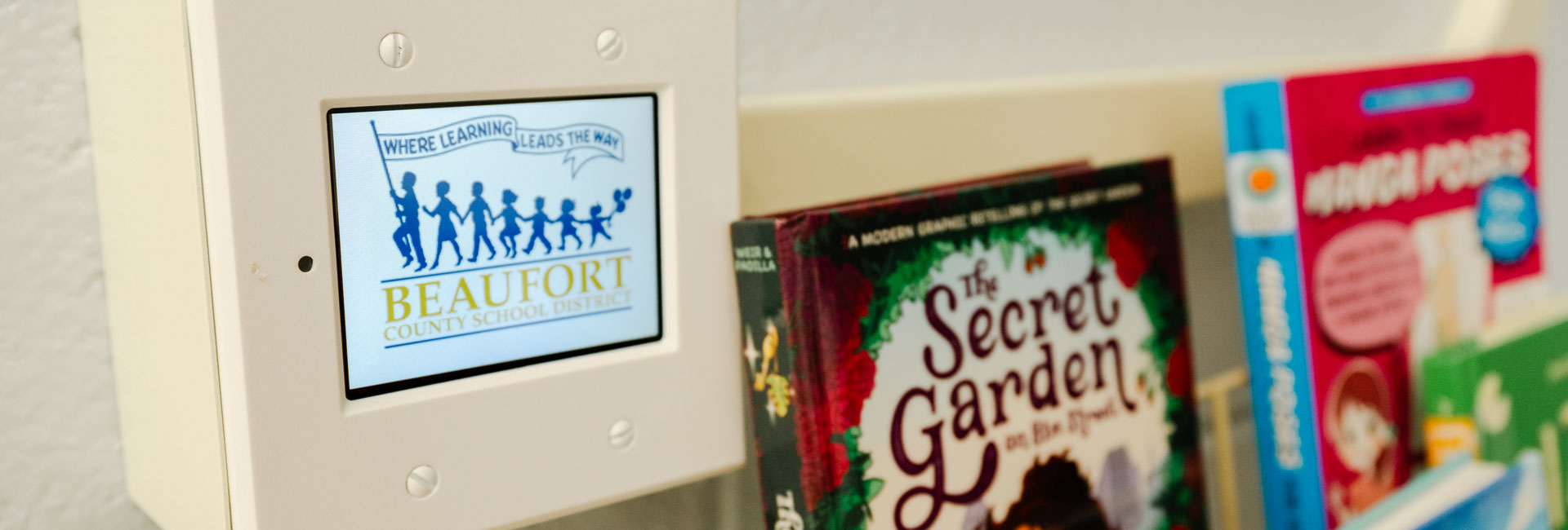 close up of books and a digital system at Beaufort County School District Lady's Island Elementary School | Media Center Renovation