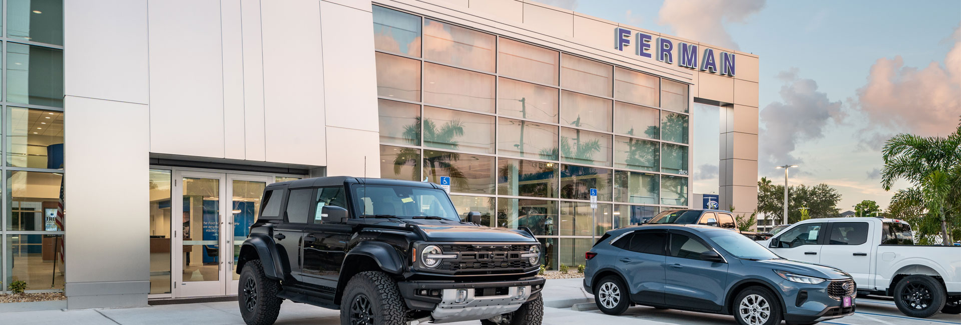 exterior with grey facade and wall of windows at Ferman Countryside Ford built by Ajax Building Company